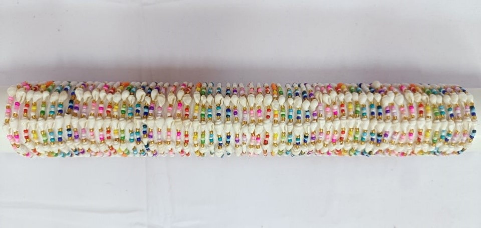 BRACCIALE PERLINE E CONCHIGLIA SU TUBO