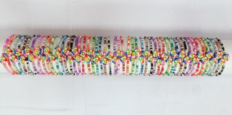 BRACCIALE PERLINE E FIMO SU TUBO